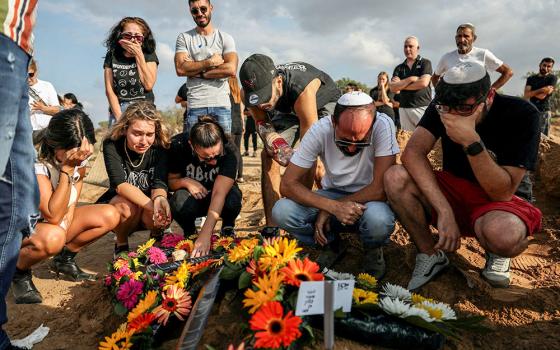 People mourn at the graveside of Eden Guez during her funeral in Ashkelon, Israel, Oct. 10, 2023. She was killed while attending a festival that was attacked by Hamas gunmen from Gaza. (OSV News/Reuters/Violeta Santos Moura)